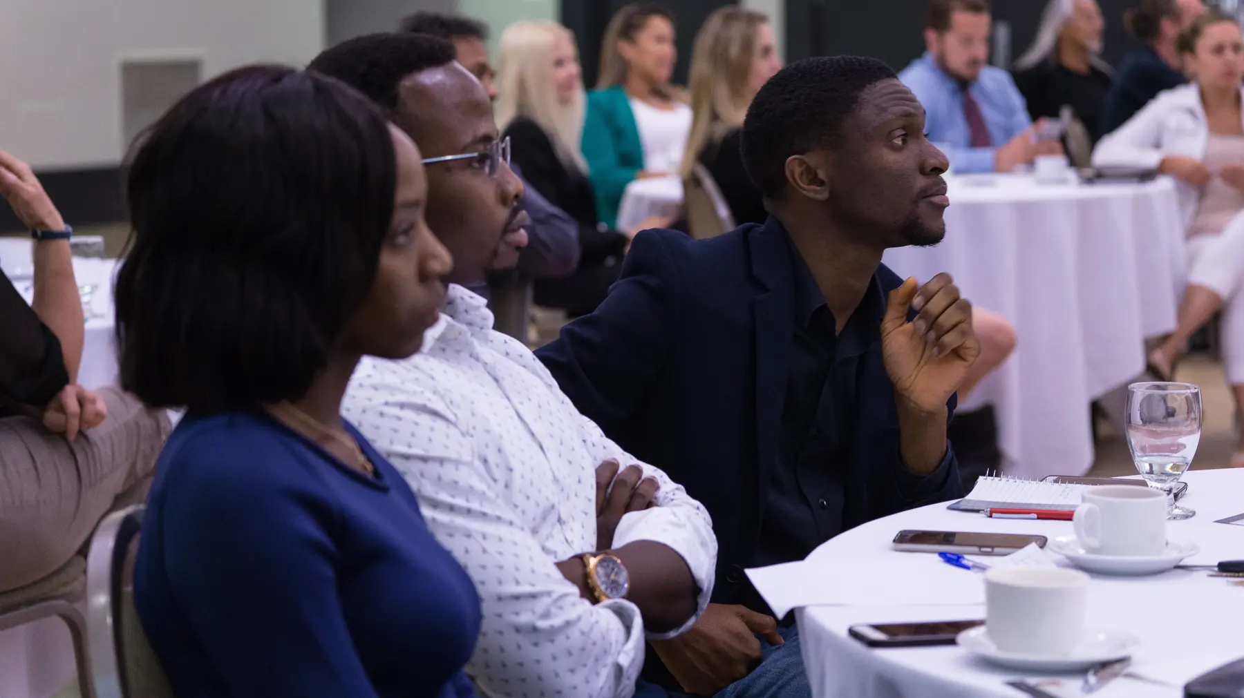 Entrepreneurs listening closely during a Team Made Hub session