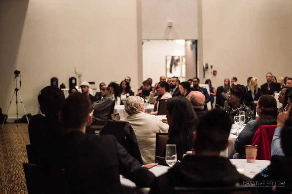 A large group of Team Made Hub members gathered after an event