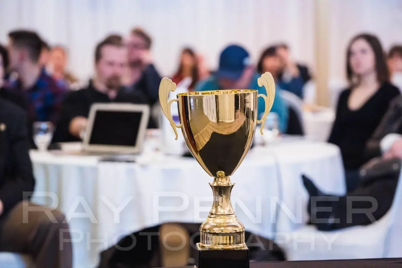 A gold achievement trophy at a Team Made Hub event